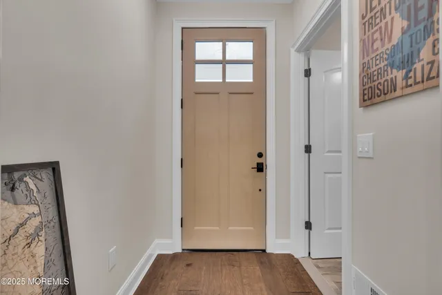 a kitchen with a stove and a white cabinets
