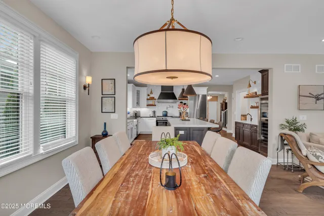 a view of staircase with railing and white walls