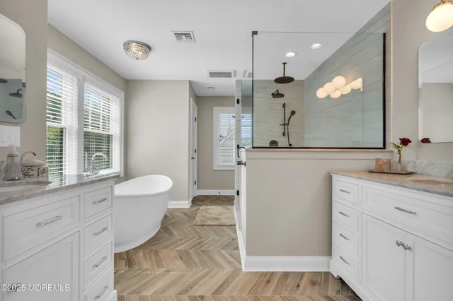 a spacious bedroom with a bed and a window