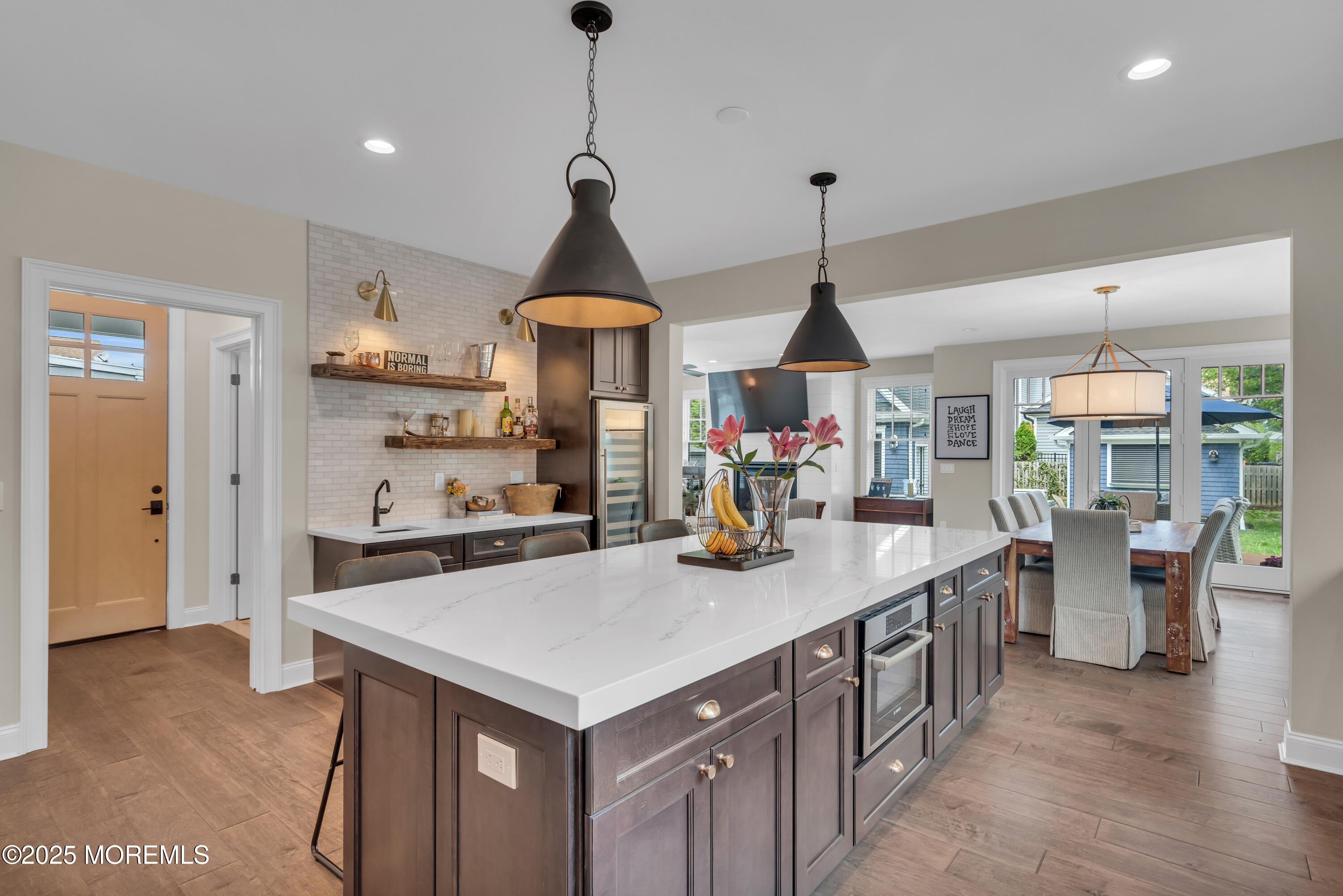 2118 Edgewood Place Spring Lake, NJ 07762 - Photo 39 of 67 a kitchen with a stove a kitchen island with a sink and cabinets