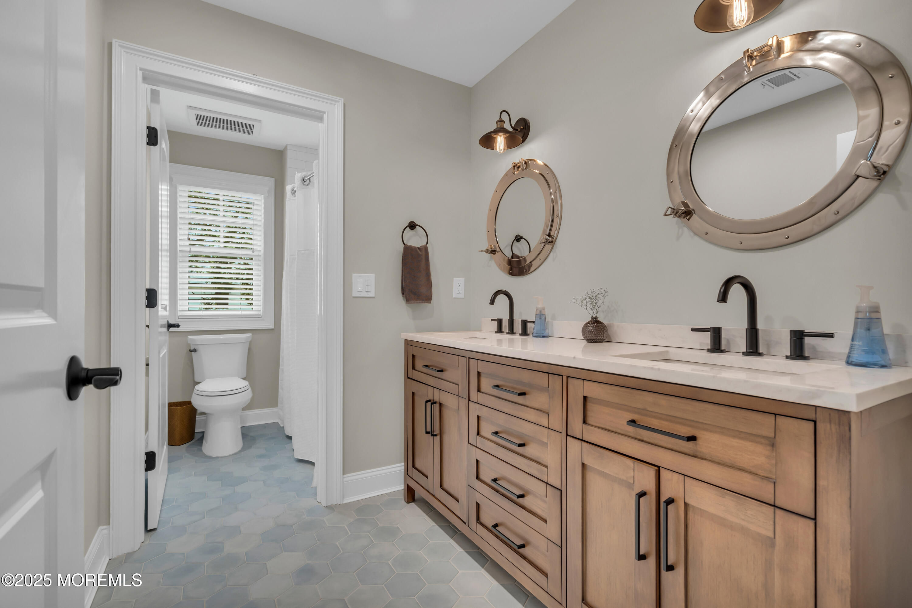 2118 Edgewood Place Spring Lake, NJ 07762 - Photo 40 of 67 a bathroom with a double vanity sink and a mirror