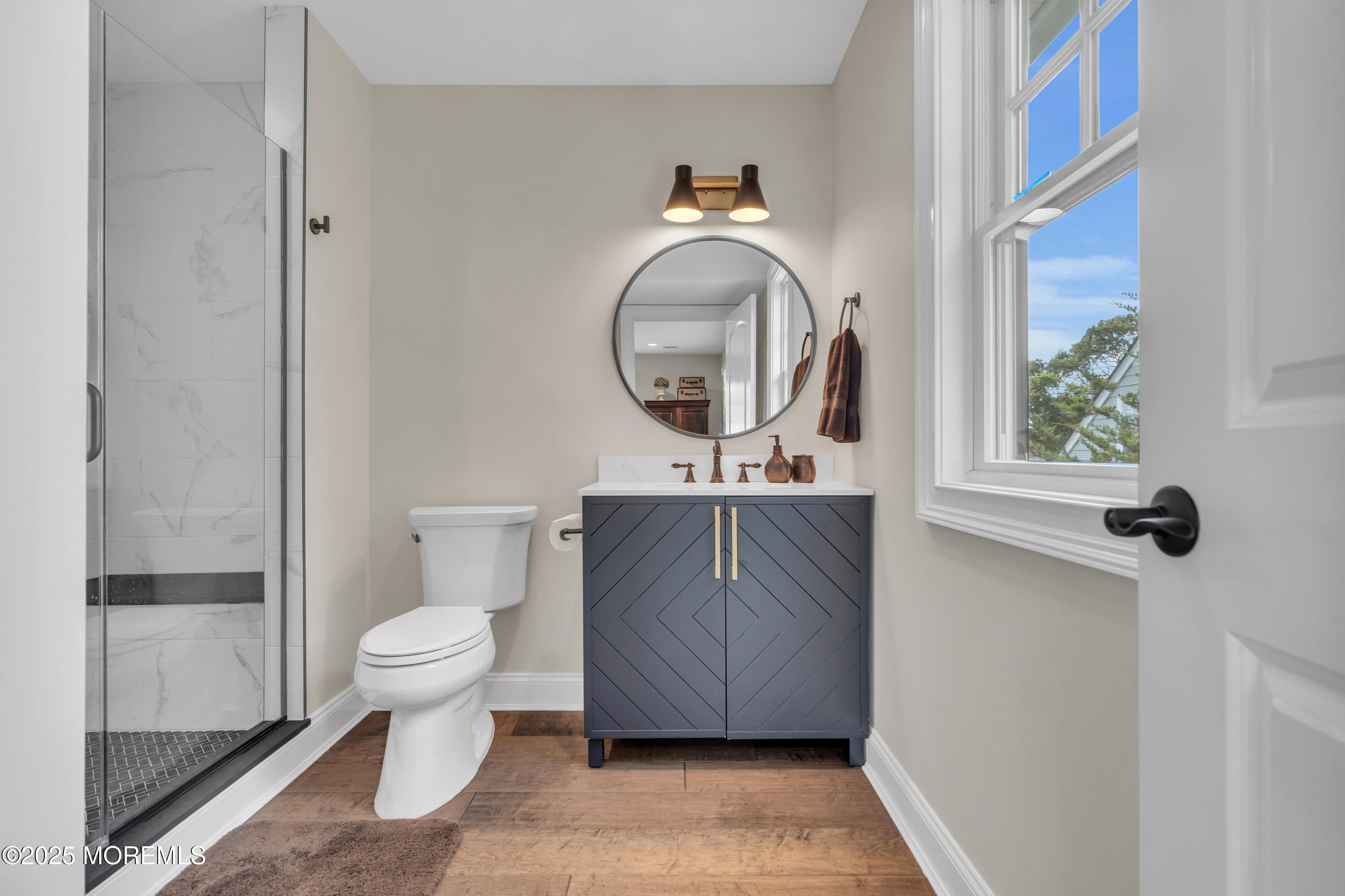 2118 Edgewood Place Spring Lake, NJ 07762 - Photo 46 of 67 a bathroom with a toilet a sink and a mirror