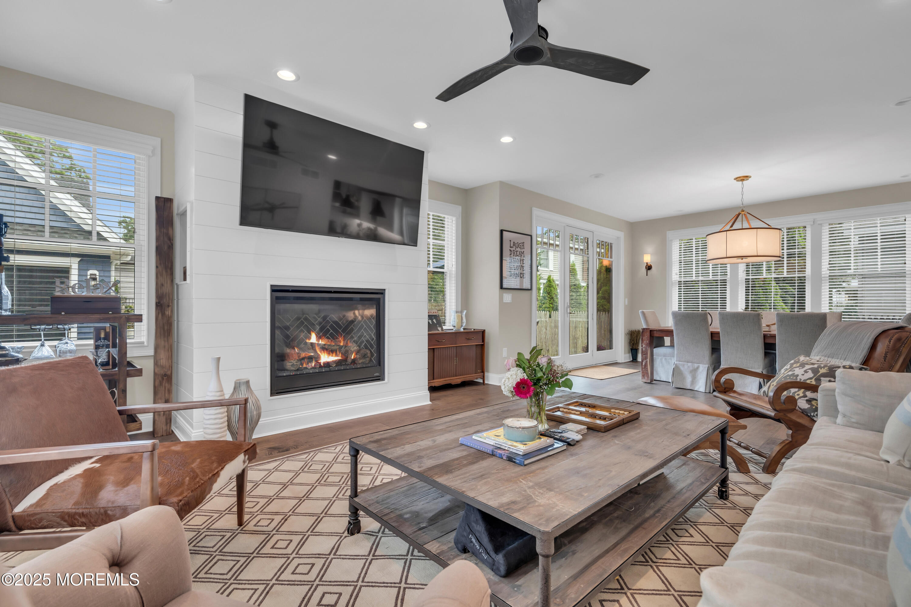 2118 Edgewood Place Spring Lake, NJ 07762 - Photo 48 of 67 a living room with furniture a table and a fireplace