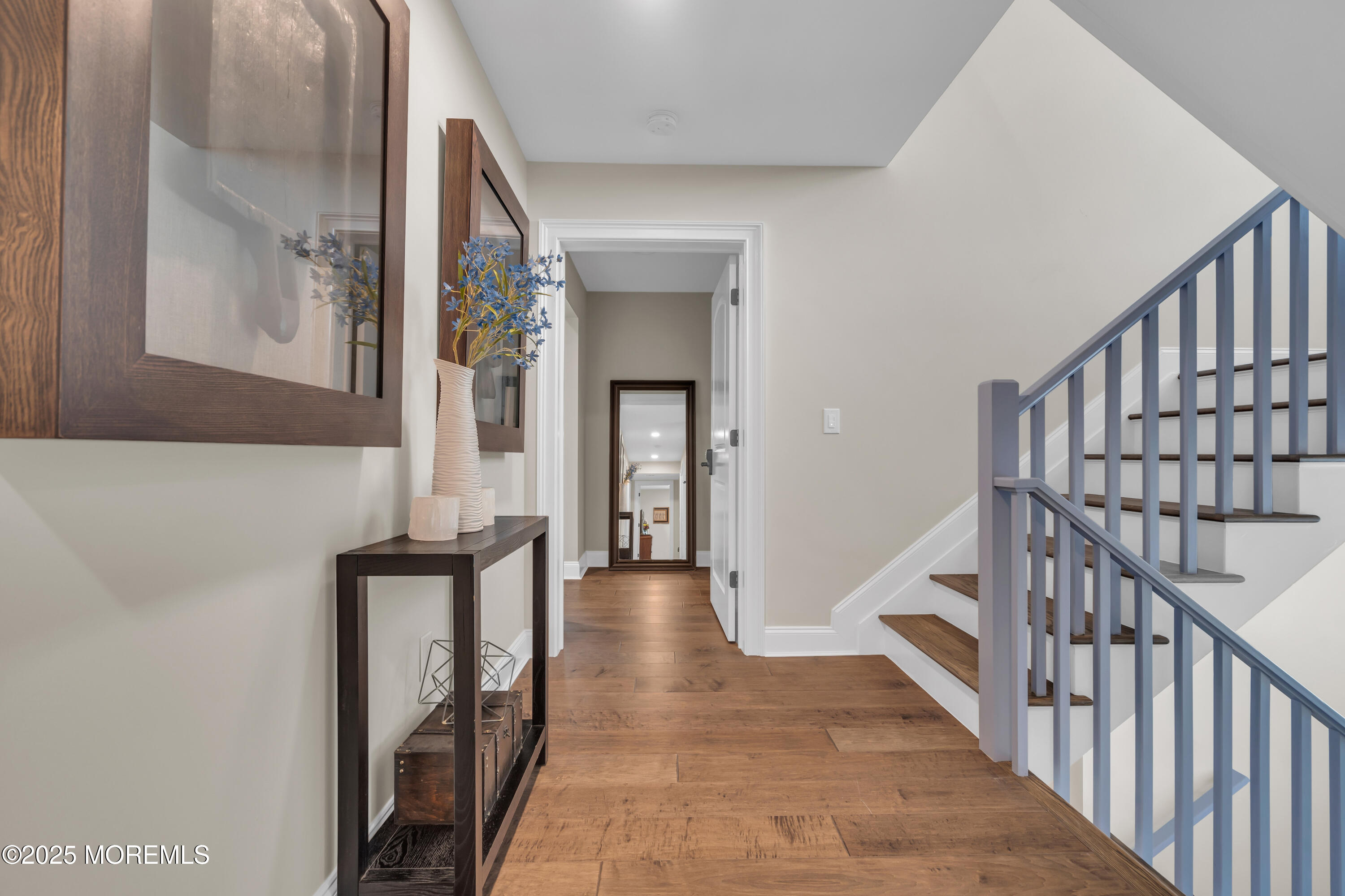 2118 Edgewood Place Spring Lake, NJ 07762 - Photo 52 of 67 a view of a hallway with wooden floor and staircase