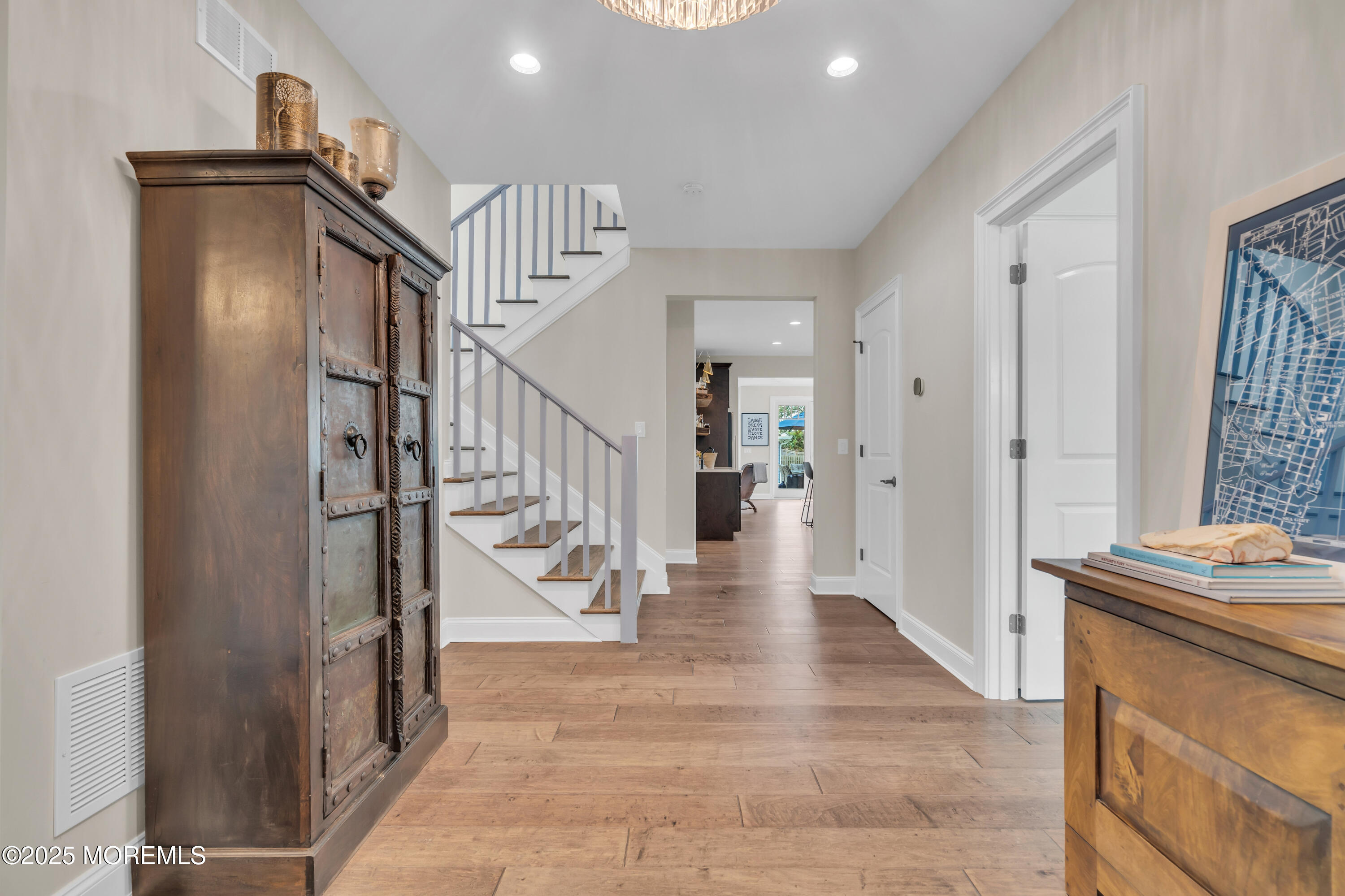 2118 Edgewood Place Spring Lake, NJ 07762 - Photo 6 of 67 a view of a hallway with wooden floor and staircase