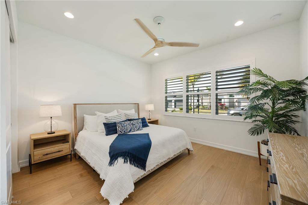 12128 Eucalyptus Way Naples, FL 34120 - Photo 19 of 47 The bedroom 2 suite is located at the front of the home, with en-suite bath, linen closet, and generous full closet.
