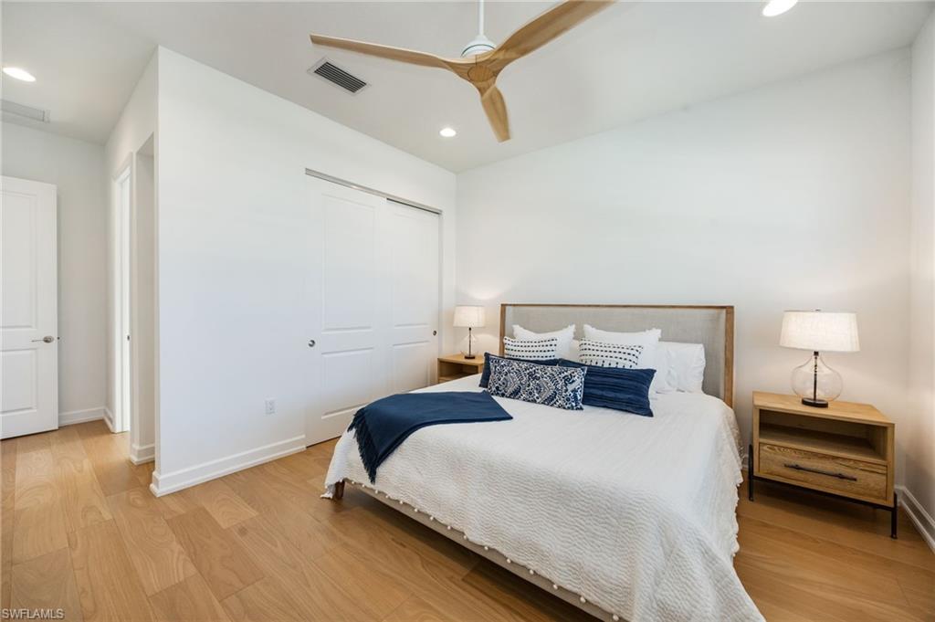 12128 Eucalyptus Way Naples, FL 34120 - Photo 20 of 47 The bedroom 2 suite is located at the front of the home, with en-suite bath, linen closet, and generous full closet.