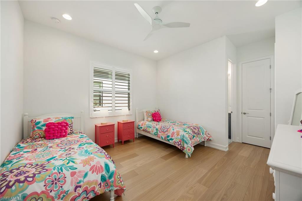 12128 Eucalyptus Way Naples, FL 34120 - Photo 22 of 47 Bedroom 3 is located in the front of the home with en-suite bath and walk-in closet.