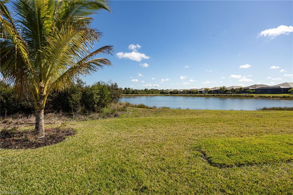 12128 Eucalyptus Way Naples, FL 34120 - Photo 26 of 47 12128 Eucalyptus Way enjoys TWO views from the outdoor living space! Landscaped preserve to the left; lake views to the right.