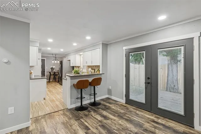 a view of kitchen center island and wooden floor