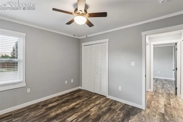 a view of room with window and ceiling fan