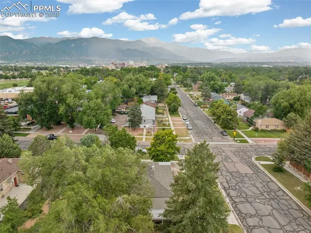 an aerial view of residential houses with outdoor space