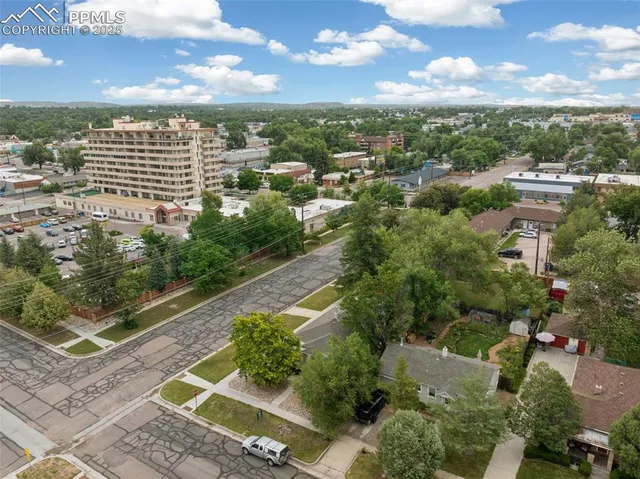 an aerial view of residential houses with outdoor space