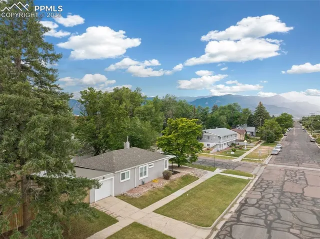 a view of a patio with table and chairs and a fire pit