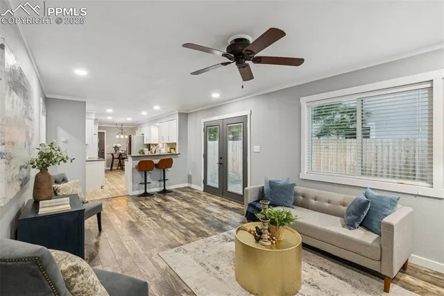 a living room with furniture and a large window