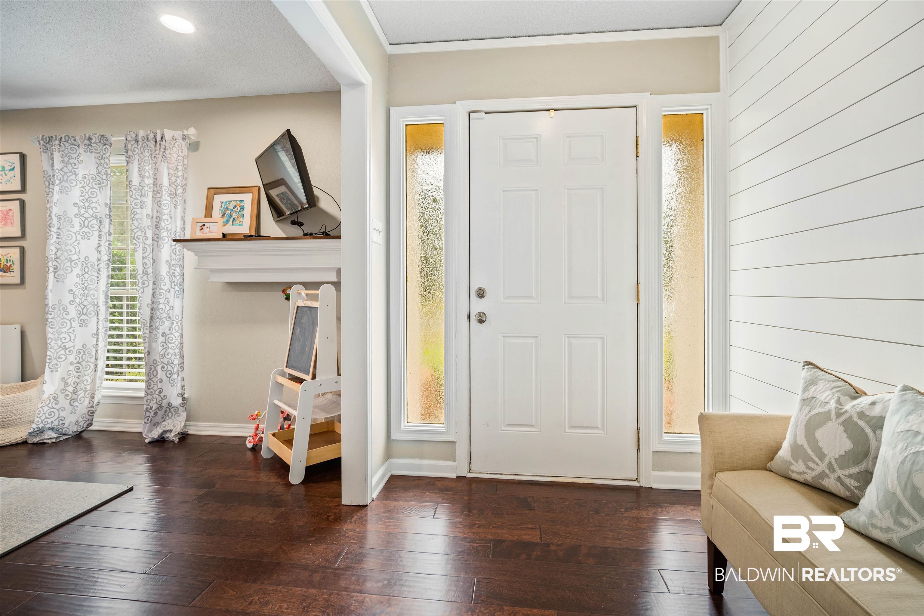 4228 Spring Valley Drive South Mobile, AL 36693 - Photo 13 of 31 Entrance foyer with a textured ceiling, dark hardwood / wood-style floors, and ornamental molding