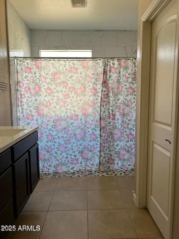 a view of a balcony with chairs and a table