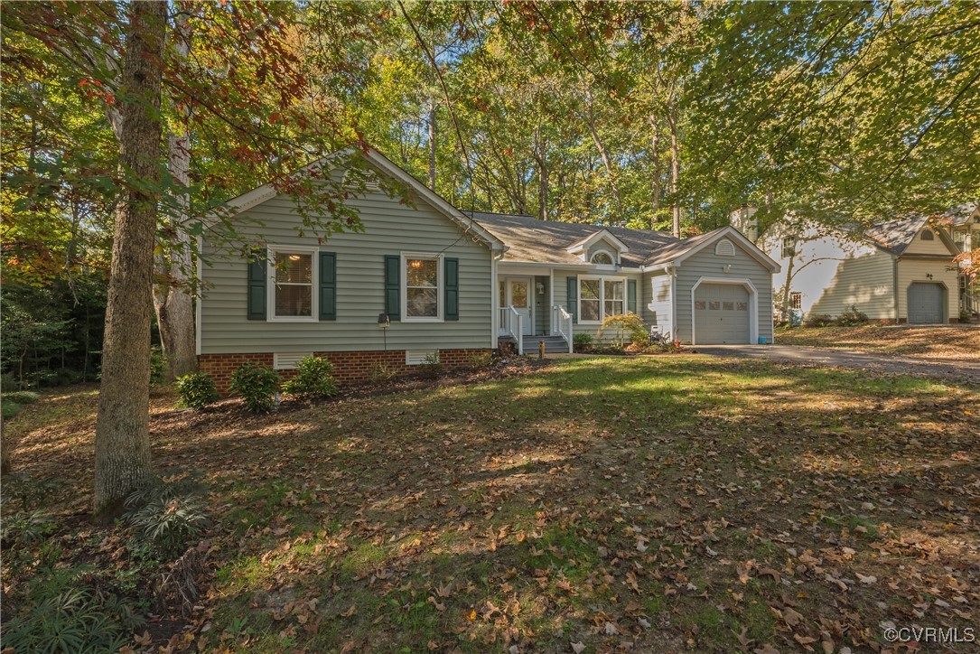 5812 Ridge Point Road Midlothian, VA 23112 - Photo 2 of 45 a front view of a house with a garden