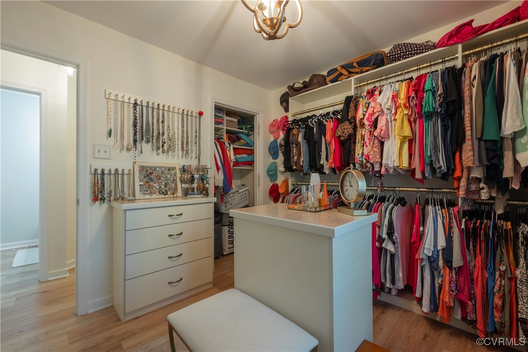 5812 Ridge Point Road Midlothian, VA 23112 - Photo 26 of 45 a view of walk in closet with clothes and shoes