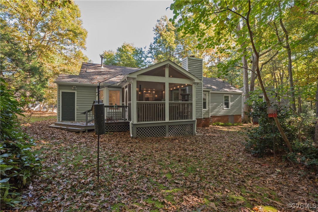 5812 Ridge Point Road Midlothian, VA 23112 - Photo 42 of 45 a house with trees in the background