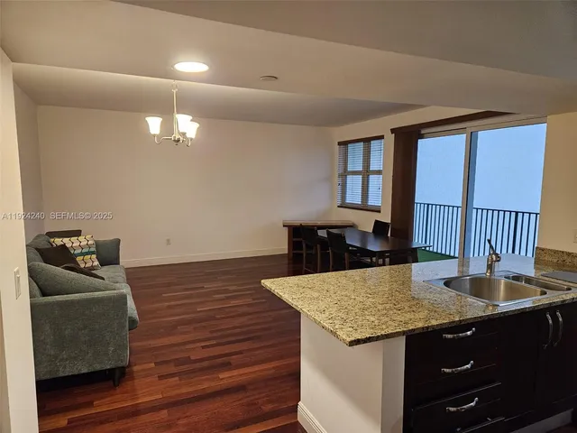 a living room with furniture and a table