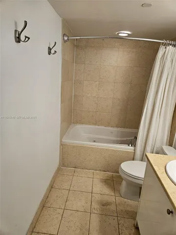 a bathroom with a bathtub and a toilet
