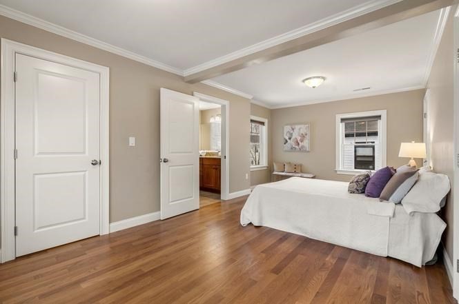 22 Myrtle Street Watertown, MA 02472 - Photo 13 of 18 a room with a bed and a couch