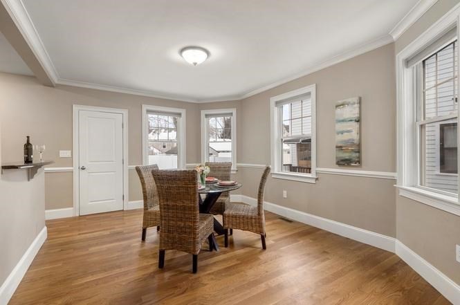 22 Myrtle Street Watertown, MA 02472 - Photo 7 of 18 a dining room with wooden floor and windows