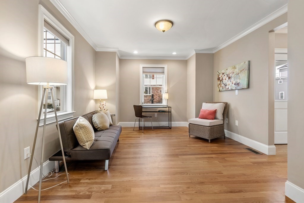22 Myrtle Street Watertown, MA 02472 - Photo 9 of 18 a living room with furniture and a table