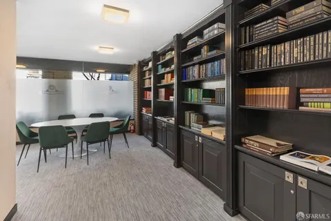 a kitchen with stainless steel appliances kitchen island granite countertop a sink and cabinets