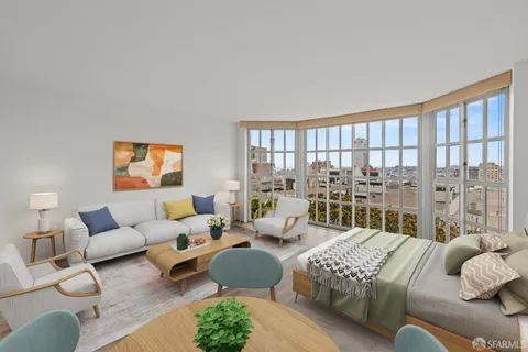 a bedroom with furniture and a large window