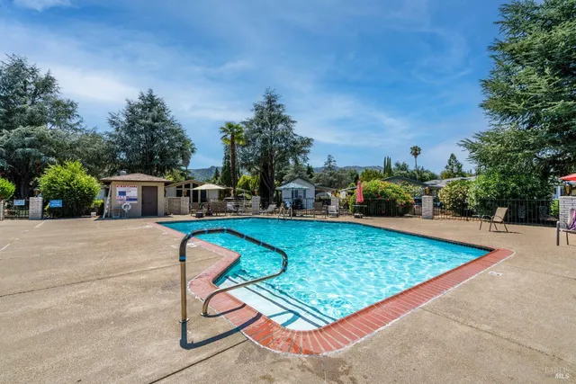 a view of a swimming pool with a patio