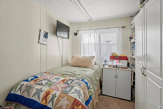 a bedroom with a bed and a closet