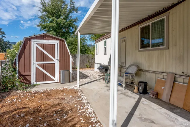 a view of backyard with cabin