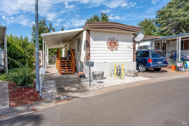 a view of building with car parked