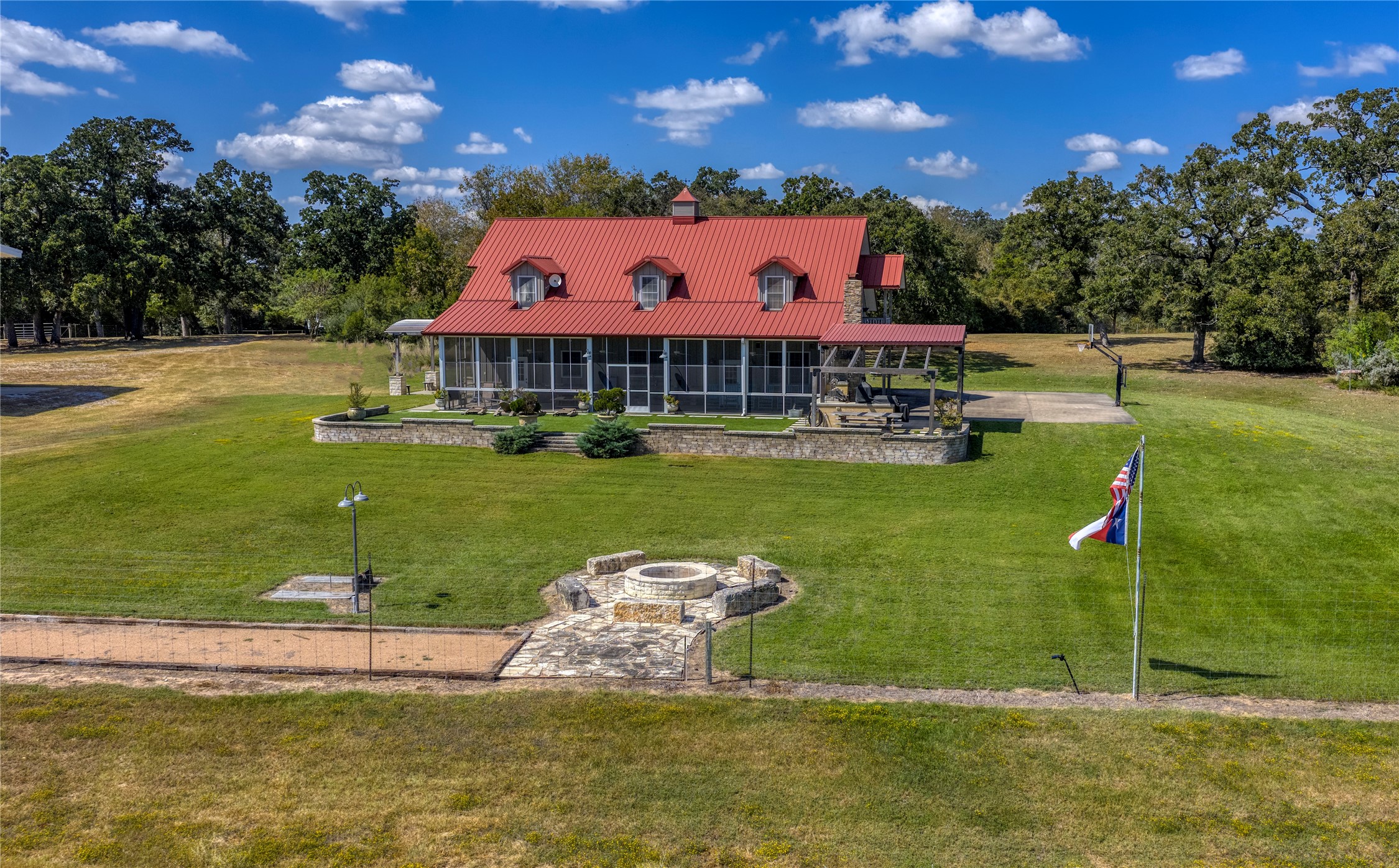 5960 Schoenau Road Brenham, TX 77833 - Photo 18 of 49 a view of a house with a yard