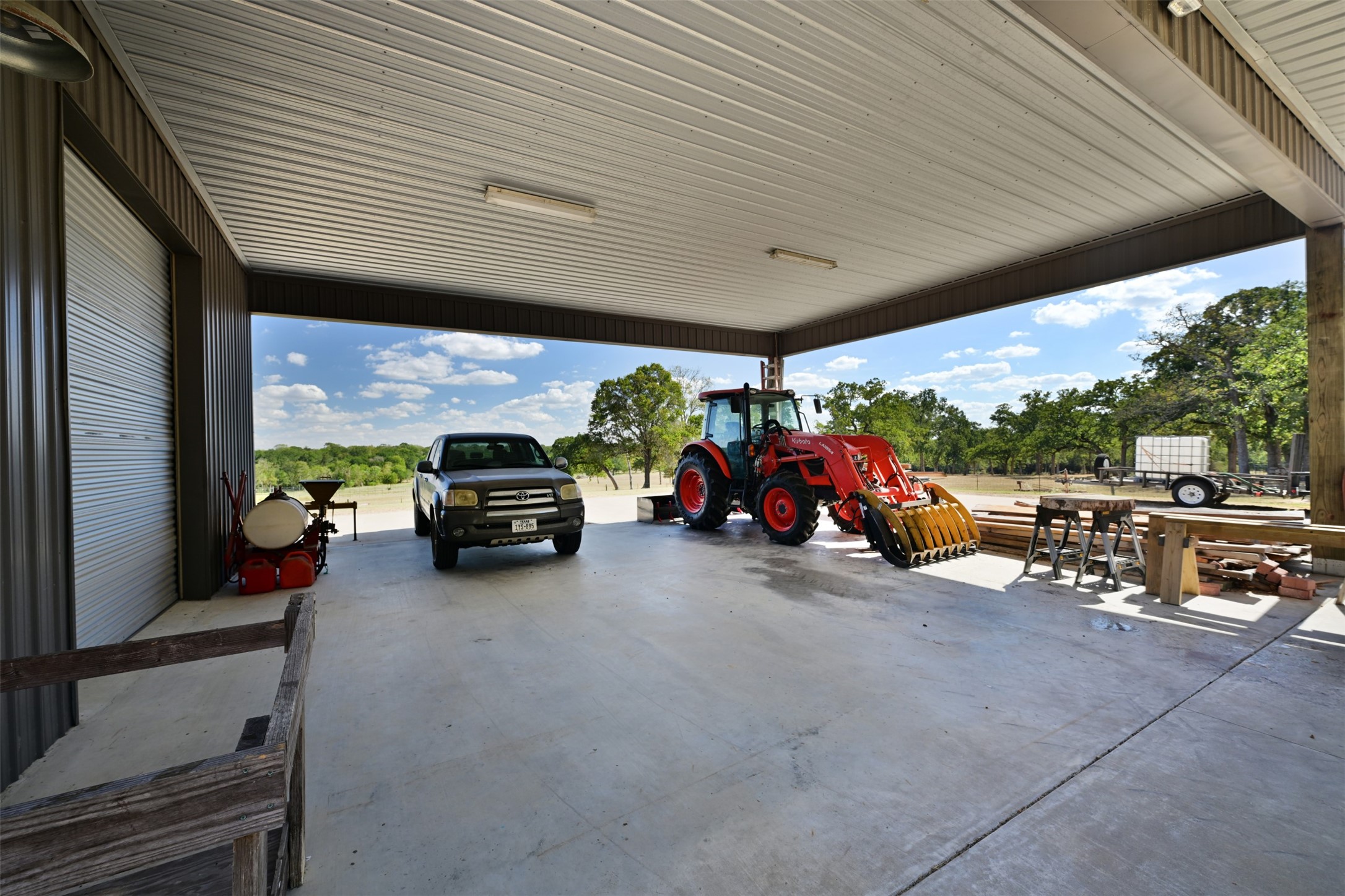 5960 Schoenau Road Brenham, TX 77833 - Photo 35 of 49 a view of a garage with parked cars