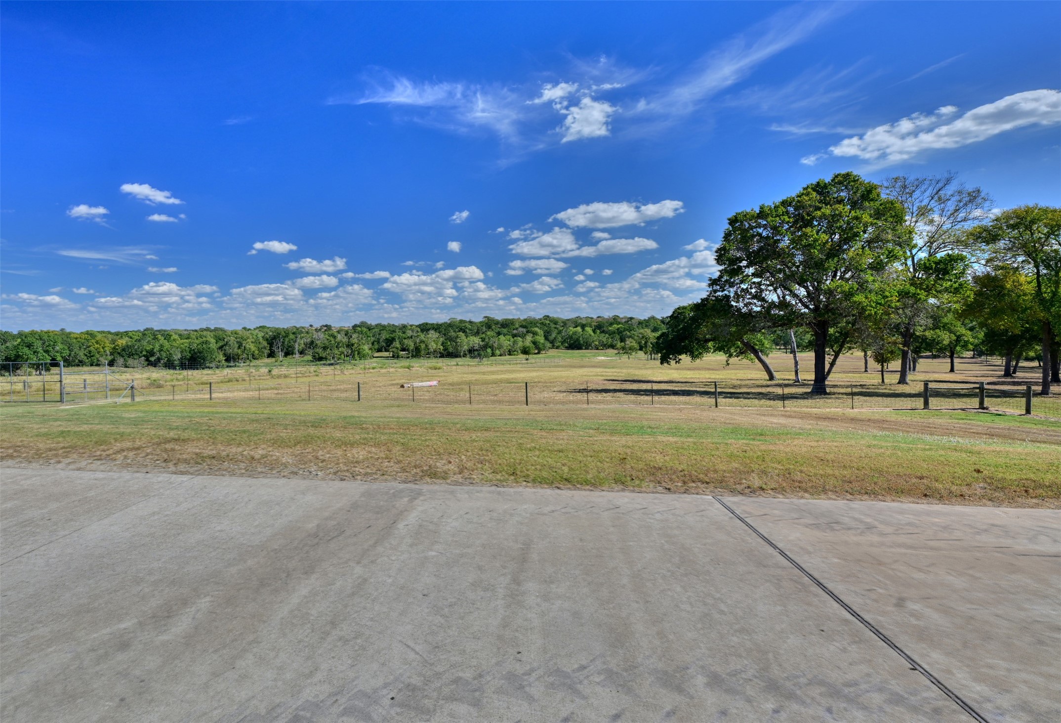 5960 Schoenau Road Brenham, TX 77833 - Photo 36 of 49 a view of a golf course with a lake