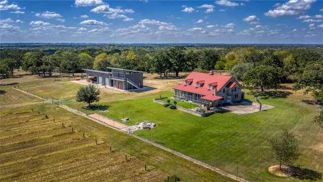 a view of a house with a yard porch and sitting area