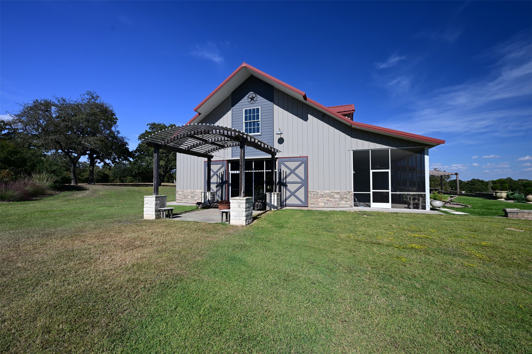 5960 Schoenau Road Brenham, TX 77833 - Photo 41 of 49 a view of a house with backyard porch and garden