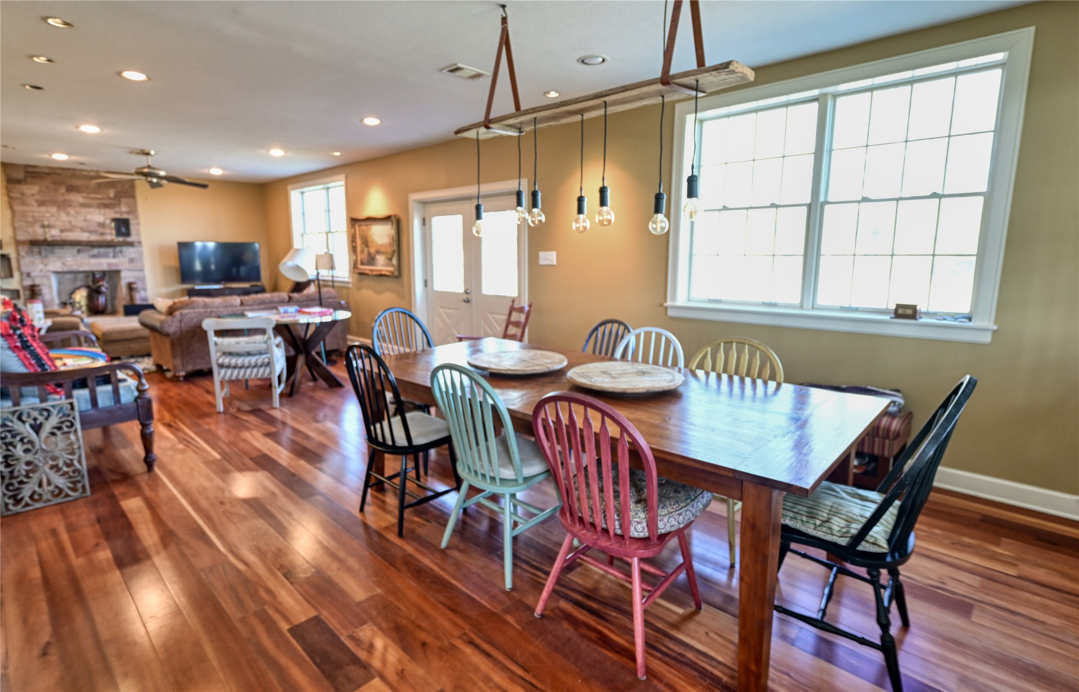 5960 Schoenau Road Brenham, TX 77833 - Photo 10 of 49 a view of a dining room with furniture window and wooden floor