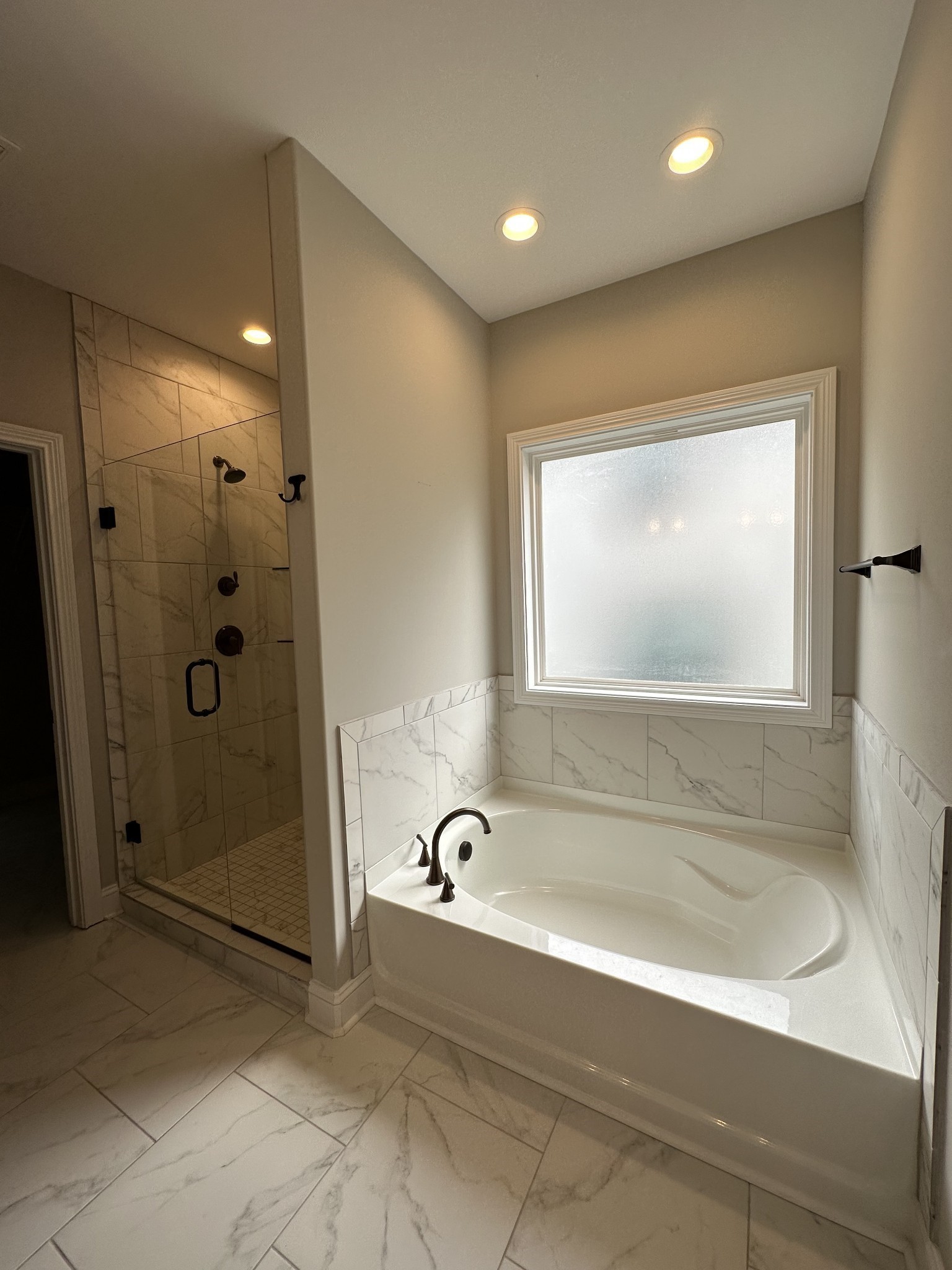 1592 Charles Bell Road Clarksville, TN 37043 - Photo 13 of 30 a bathroom with a bathtub and shower