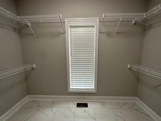 a view of a room with racks on the wall