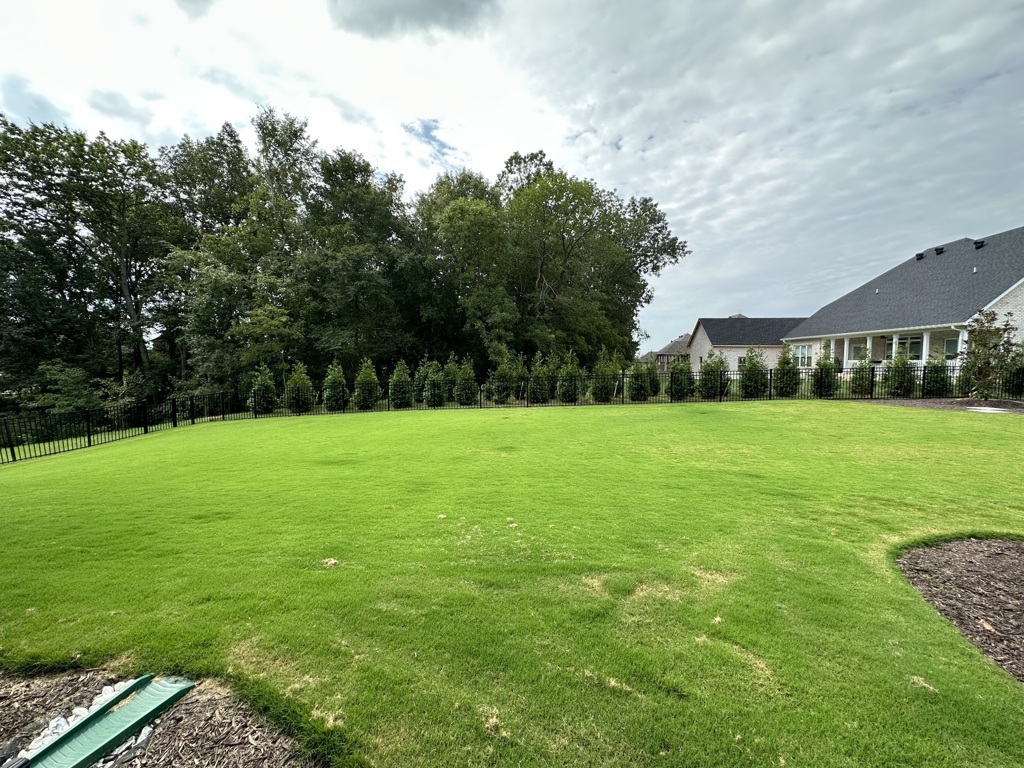 1592 Charles Bell Road Clarksville, TN 37043 - Photo 29 of 30 a view of a green field with wooden fence