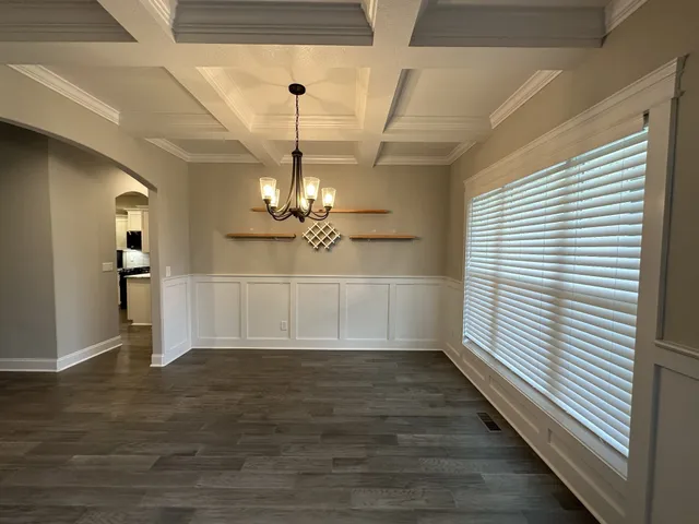 a view of a livingroom with wooden floor