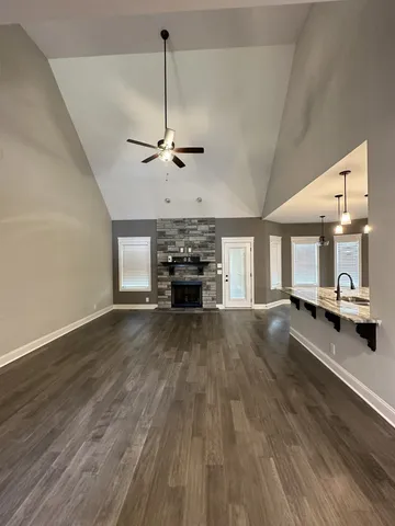 a view of a kitchen and a stove top oven