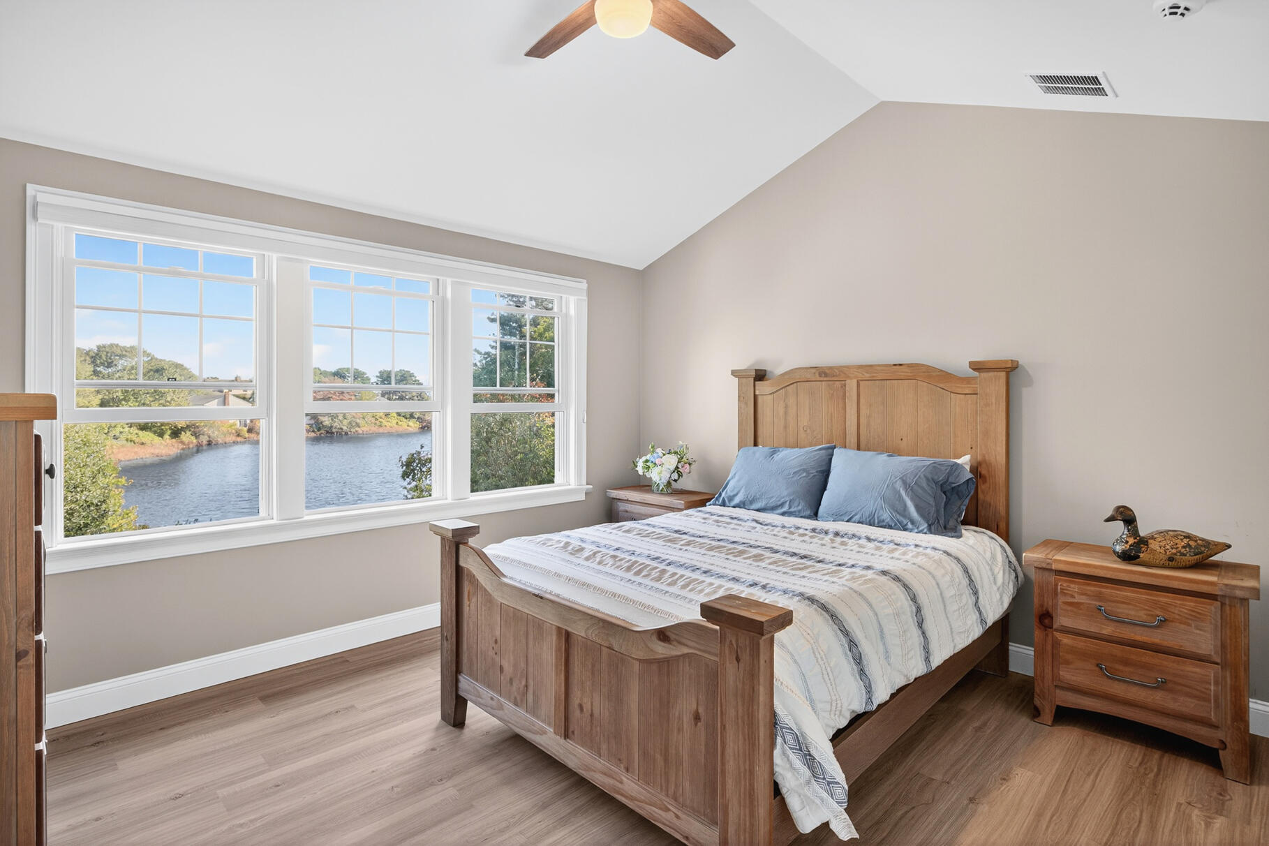 128 Uncle Percy's Road Mashpee, MA 02649 - Photo 27 of 45 a bedroom with a bed and a large window