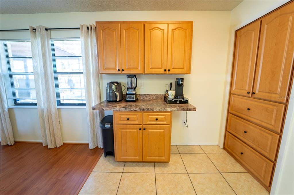 1394 Escobar Avenue Spring Hill, FL 34608 - Photo 15 of 47 a kitchen with stainless steel appliances a stove top oven and cabinets