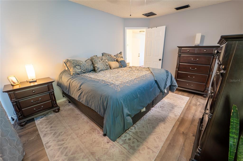 1394 Escobar Avenue Spring Hill, FL 34608 - Photo 18 of 47 a bedroom with a bed and a closet