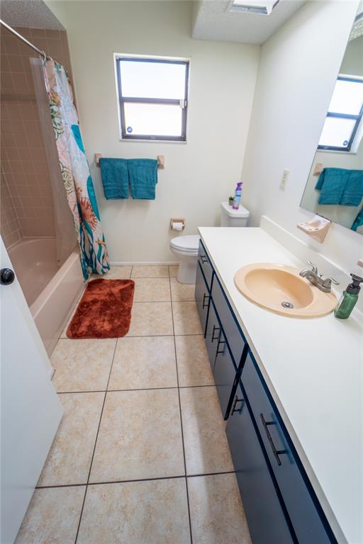 1394 Escobar Avenue Spring Hill, FL 34608 - Photo 26 of 47 a bathroom with a sink a toilet and mirror